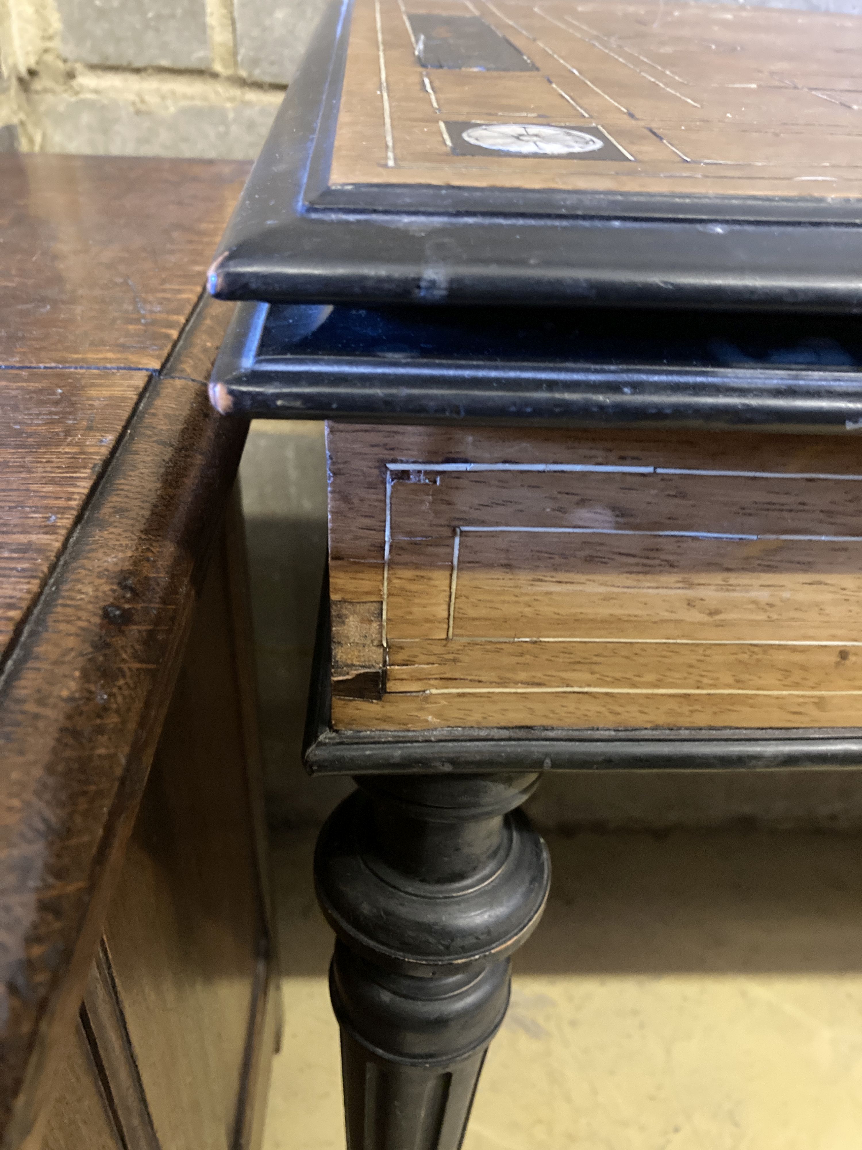 A 19th century Italian inlaid walnut and ebonised card table with folding top (faults), width 94cm, depth 47cm, height 75cm